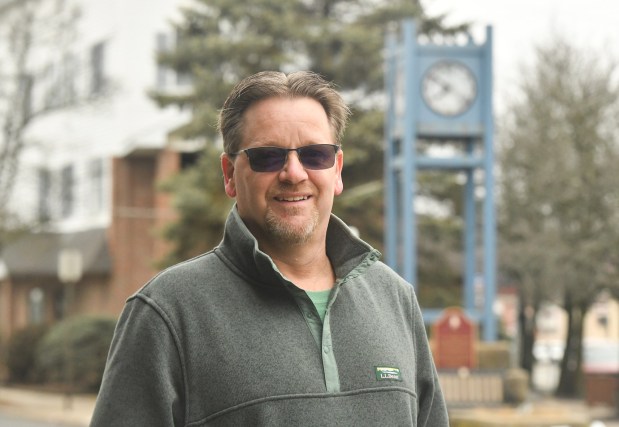 Mike Parry, friend of Laura Lee DeFazio Morabito who died on 9/11, poses for a photograph on State St. near the borough's clock tower Friday, March 6, 2026. (SEAN MCKEAG / STAFF PHOTOGRAPHER)