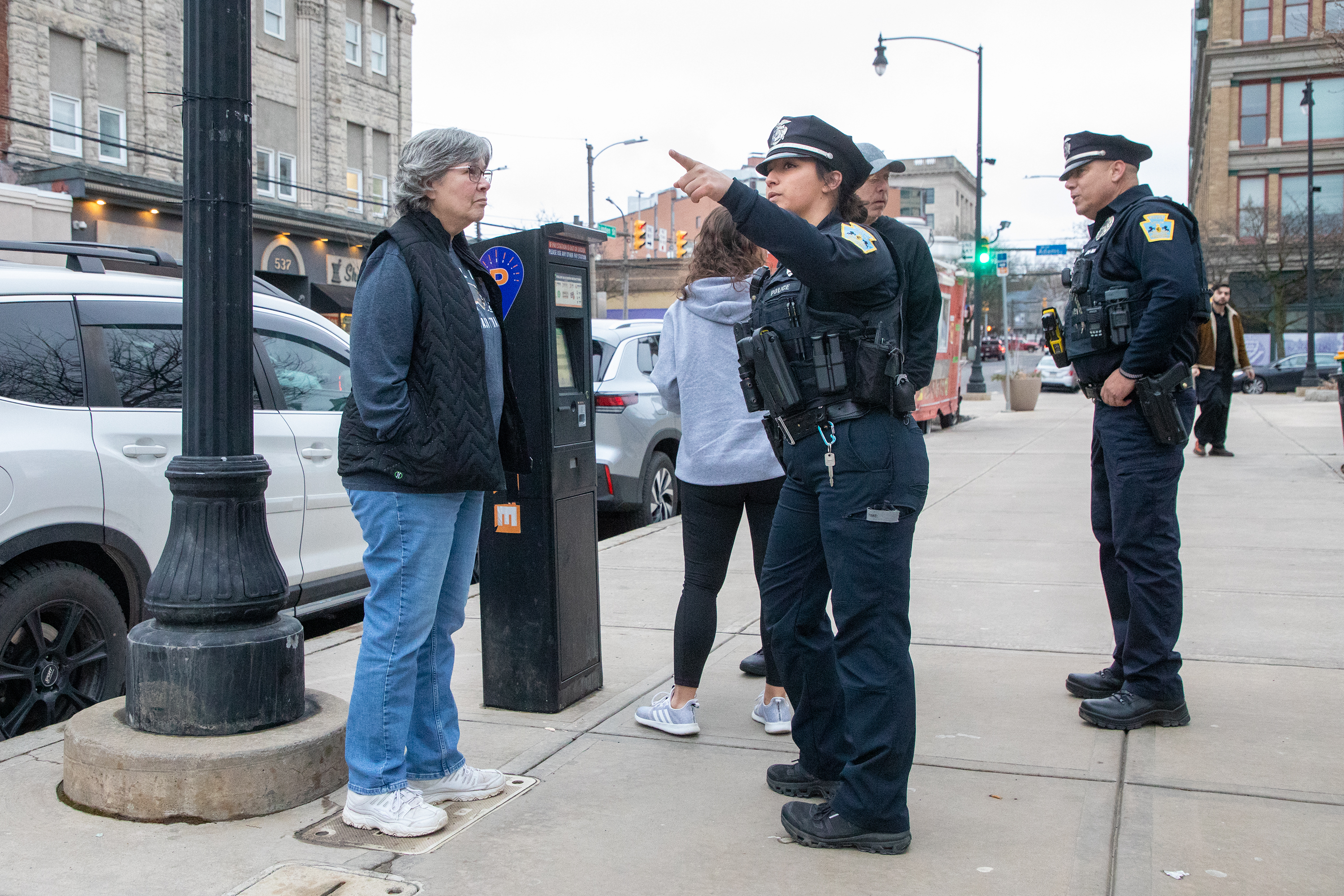 Patrol officer Olivia Muchal gives directions to Charlotte Disney in...