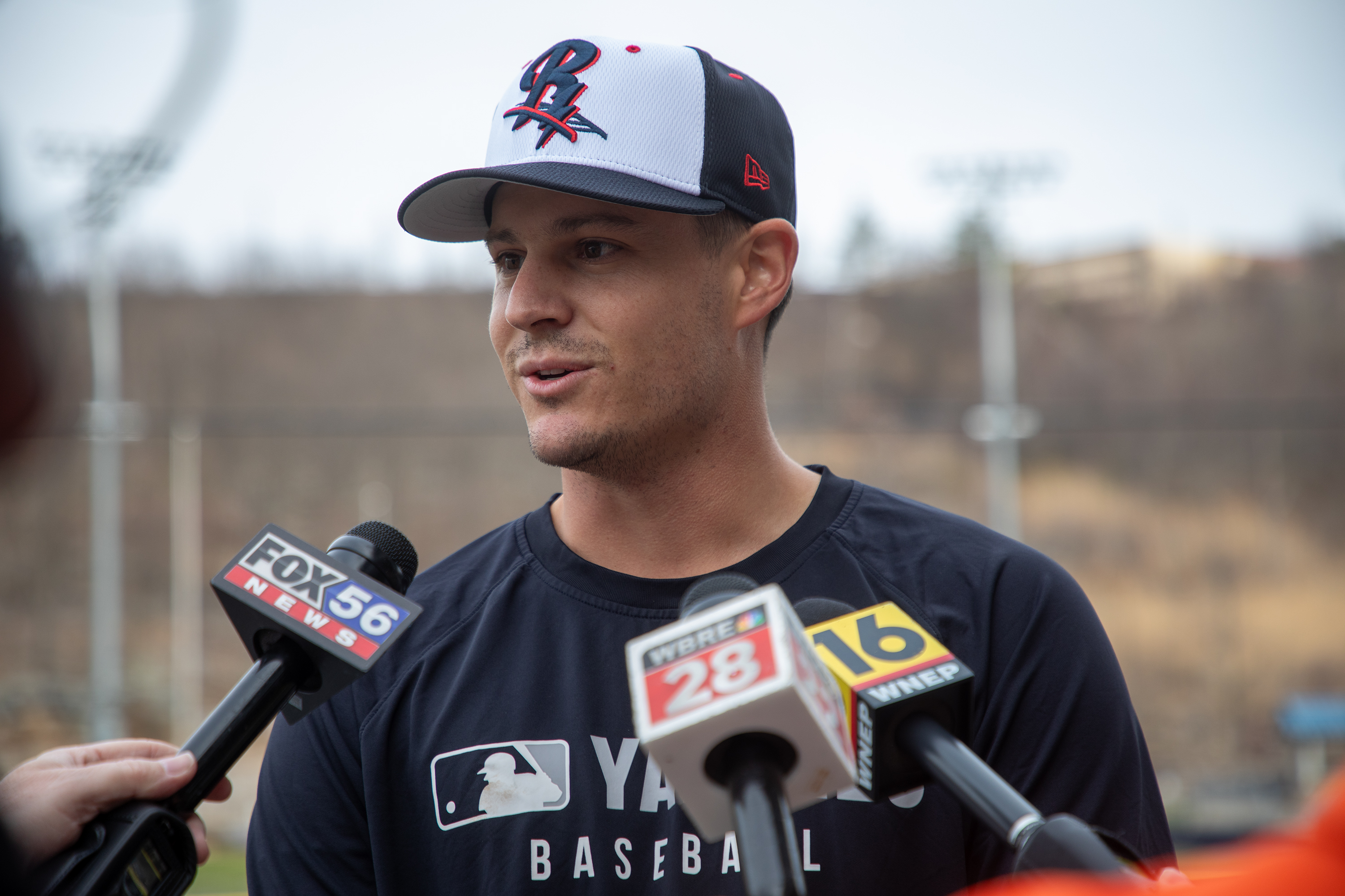 Pitcher Brendan Beck talks to the press about being named...