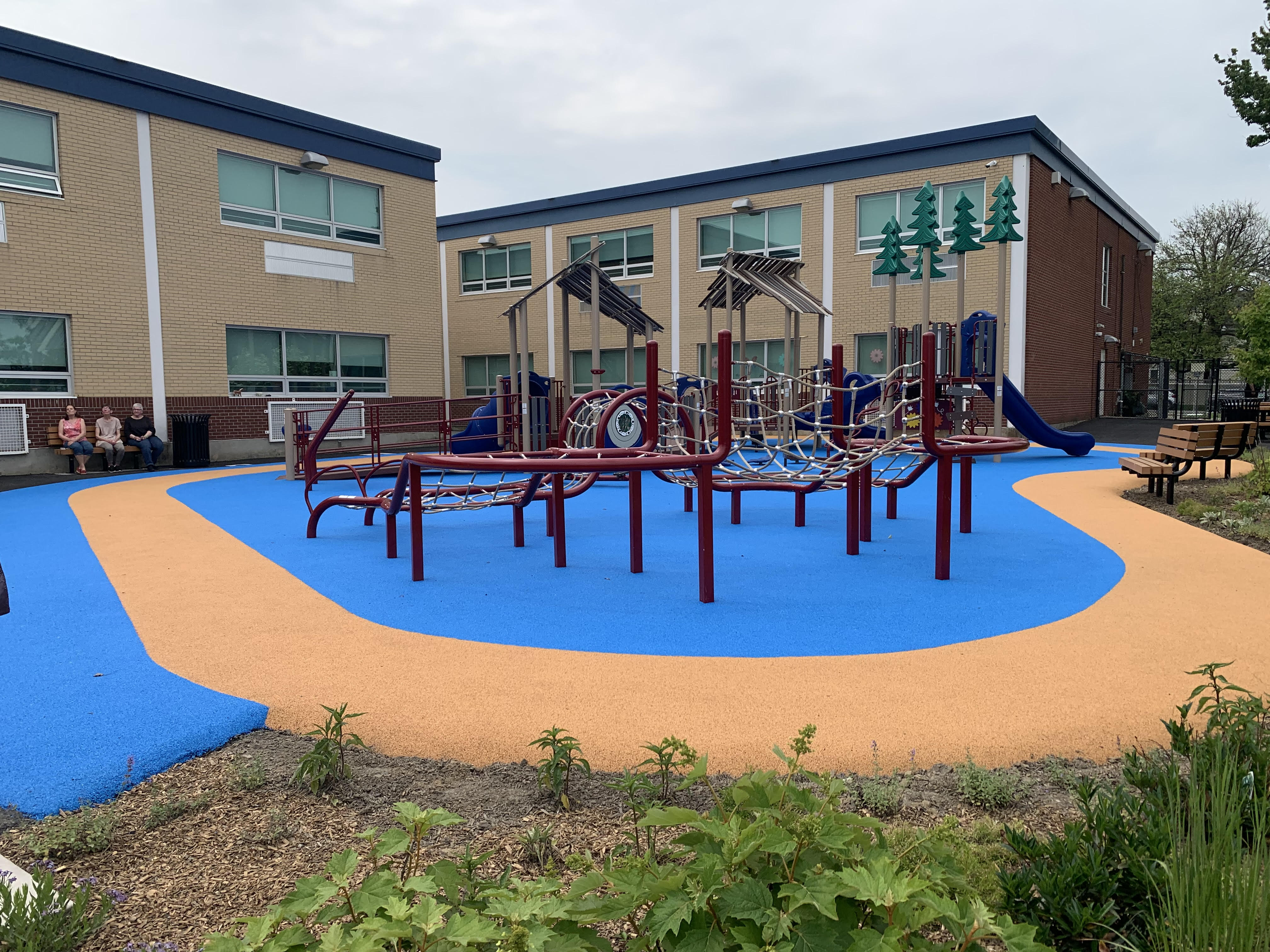 The new community schoolyard playground at John F. Kennedy Elementary...