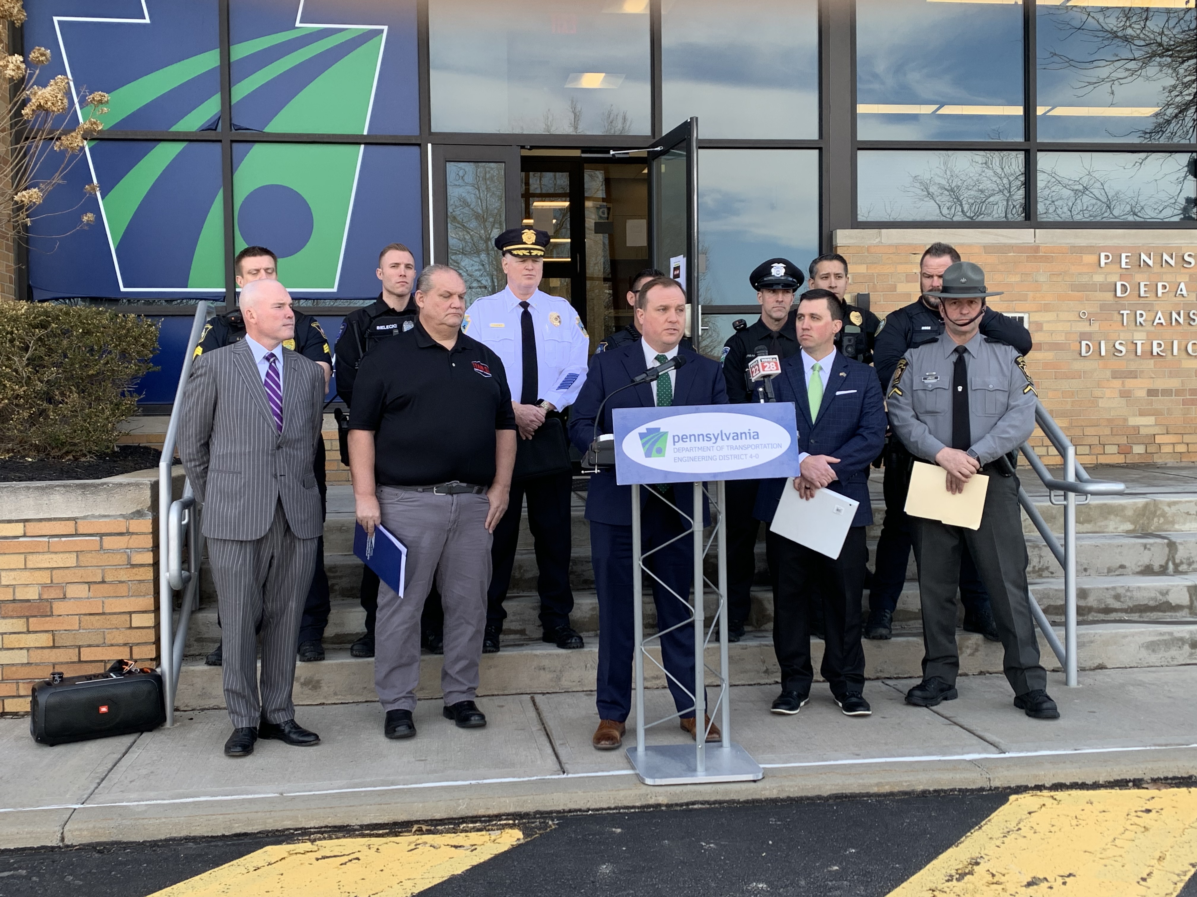 Lackawanna County District Attorney Brian Gallagher, at podium speaks on...