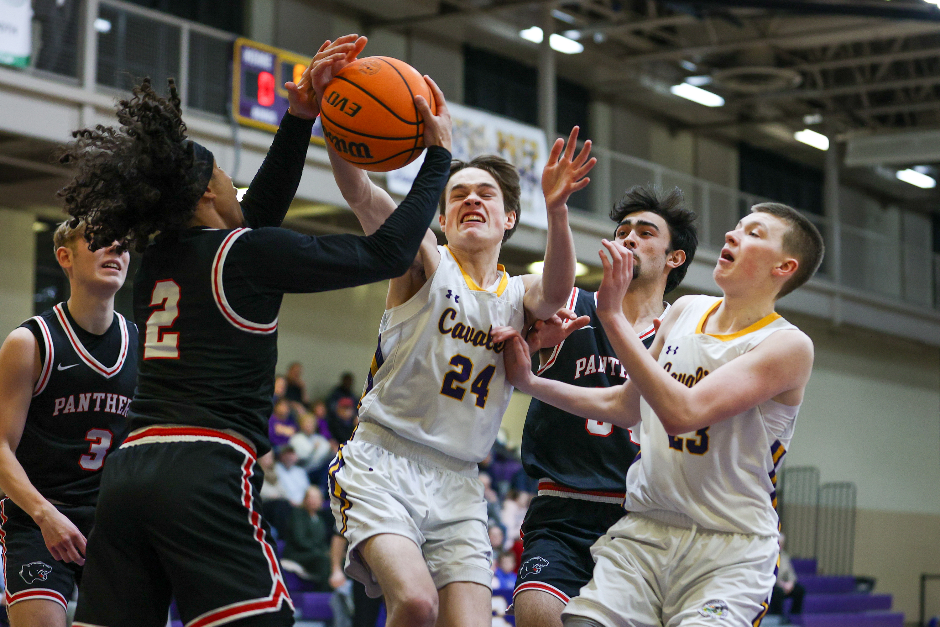 Scranton Prep’s Charlie Skoff (24) attempts to grab a rebound...
