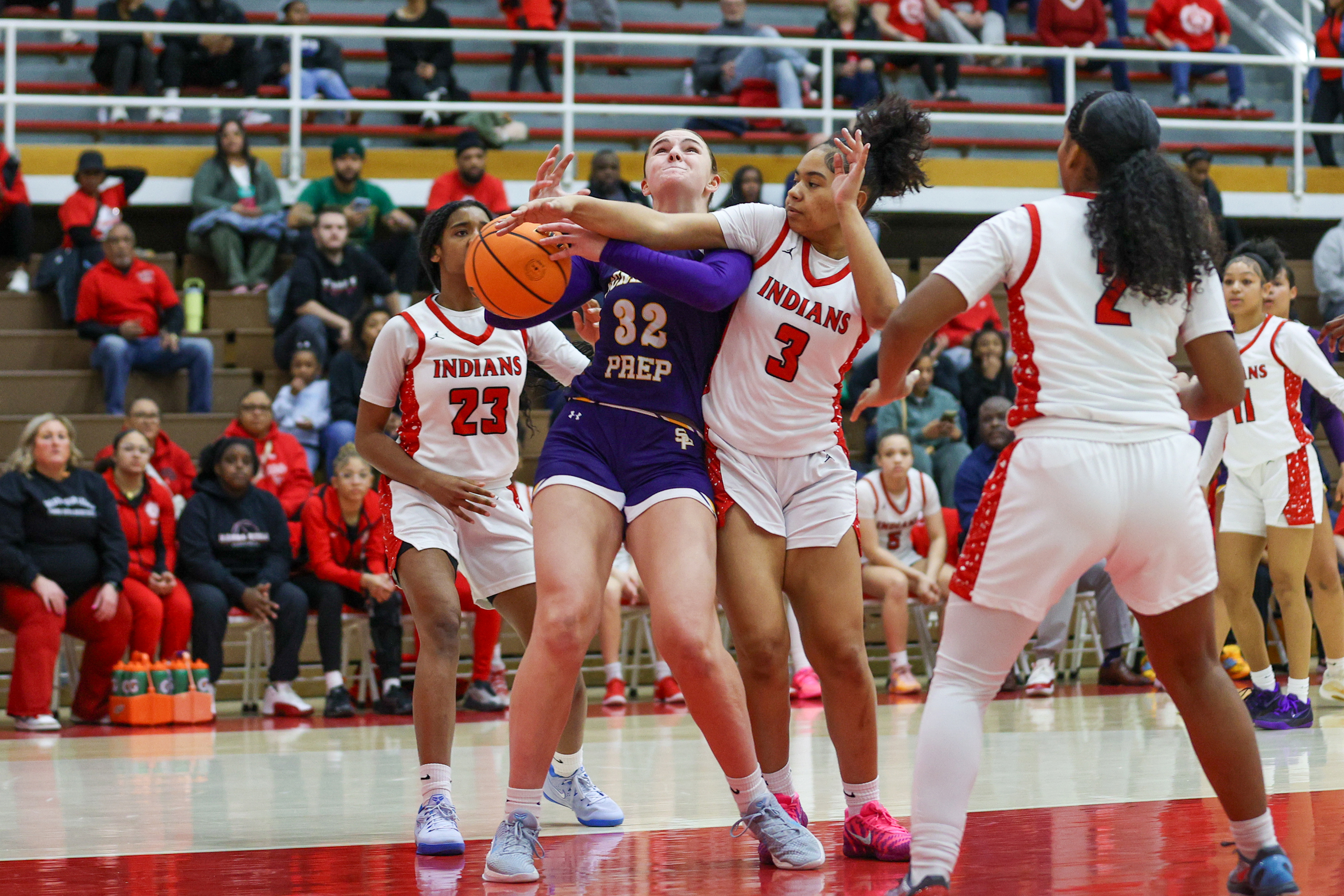 Susquehanna Township’s Ja’Zara Lee (3) prevents Scranton Prep’s Chloe Mamera...