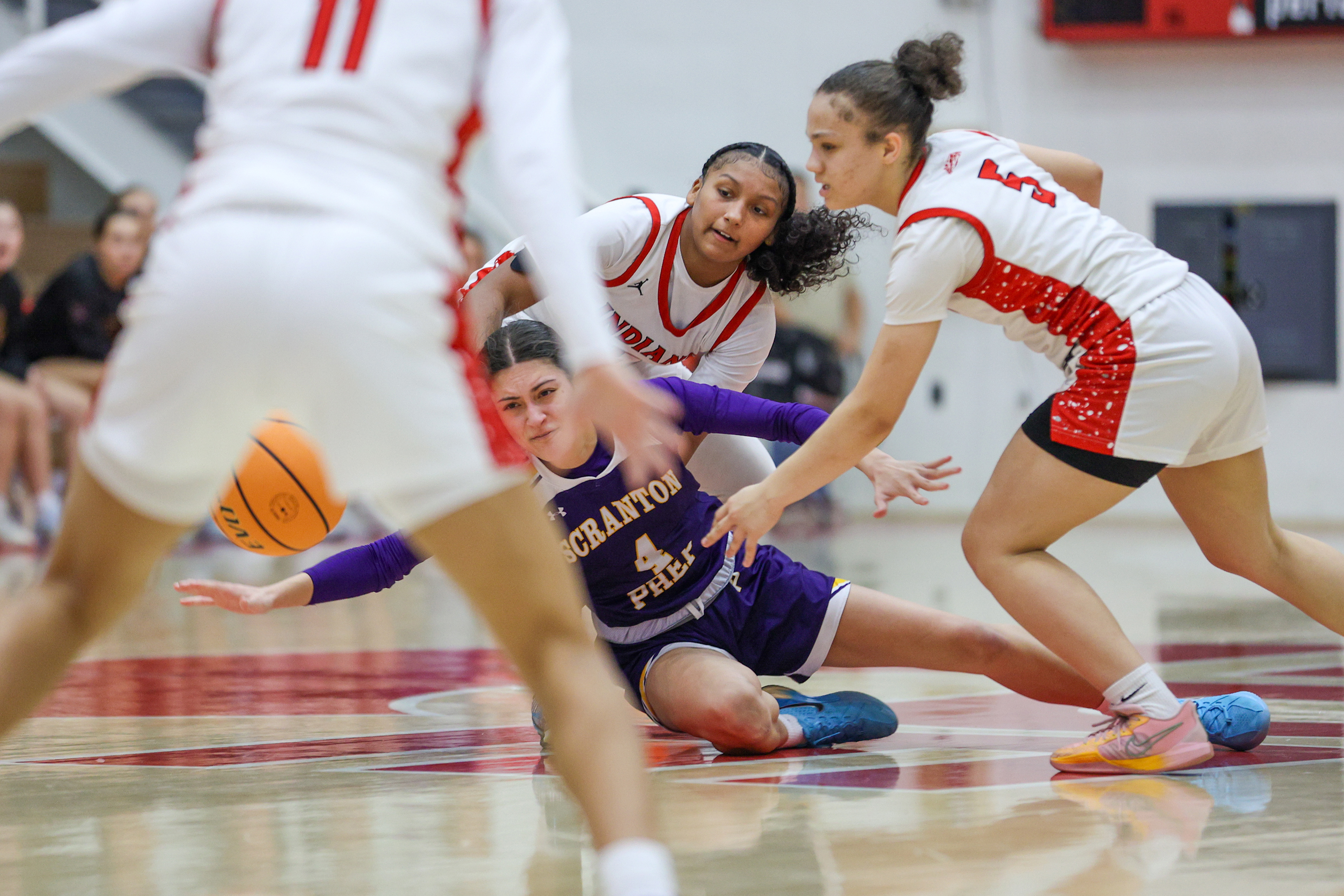 Scranton Prep’s Ava Fenton (4) loses control of the ball...