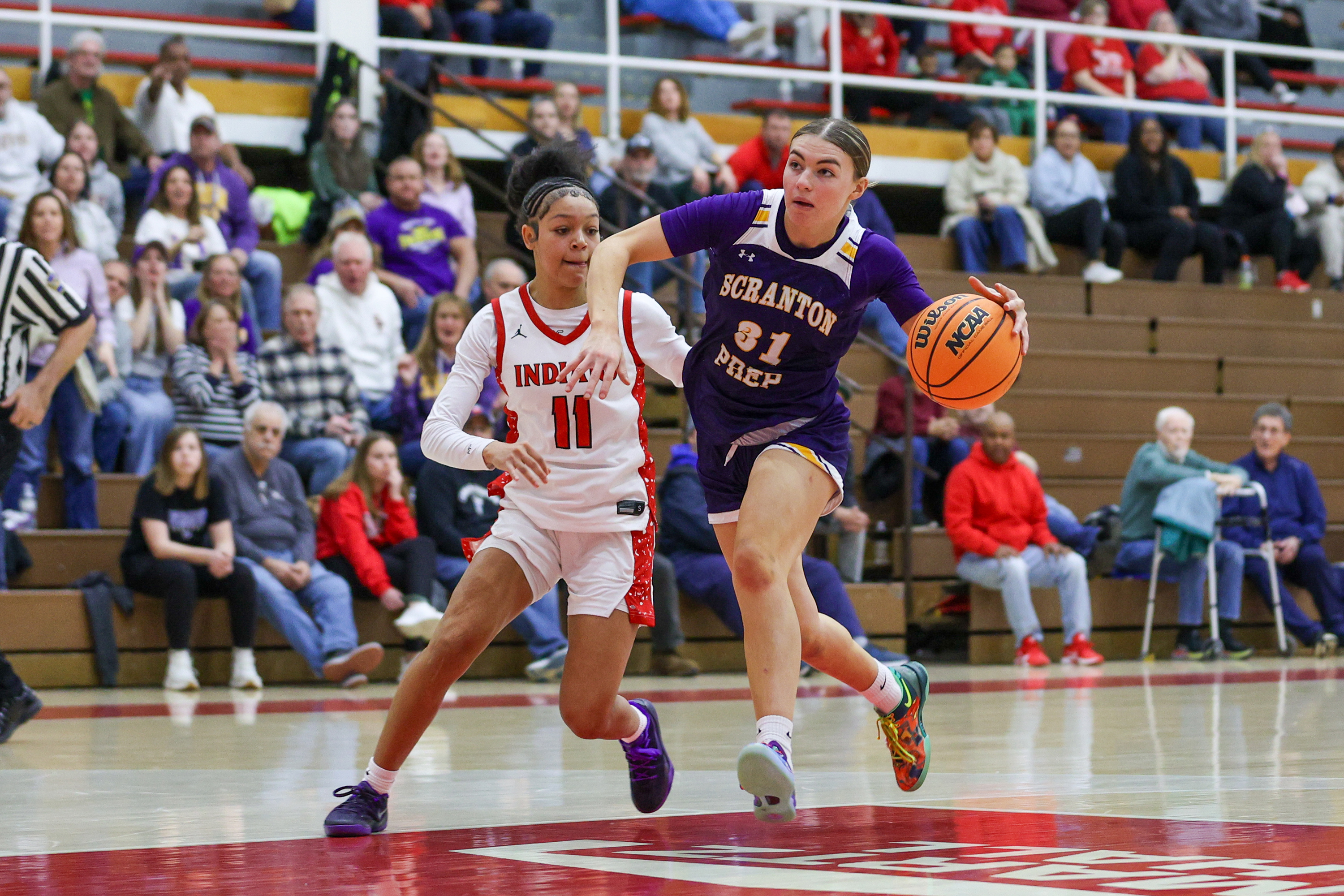 Scranton Prep’s Eva Kaszuba (31) drives toward the basket during...