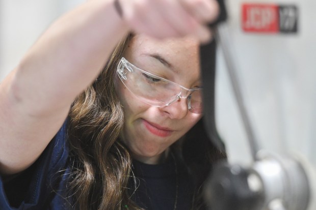 Old Forge eighth-grade student Luciana Metzger uses a dril press to make a candle holder during the Girls on Fire STEM event at Johnson College in Scranton Wednesday, March 11, 2026. (SEAN MCKEAG / STAFF PHOTOGRAPHER)