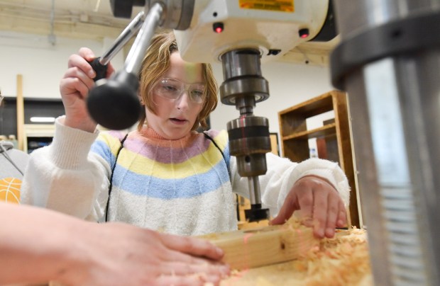 Karina Stone, sixth-grade student at Susquehanna Community Elementary School, uses a drill press to make a candel holder during the Girls on Fire STEM event at Johnson College in Scranton Wednesday, March 11, 2026. (SEAN MCKEAG / STAFF PHOTOGRAPHER)