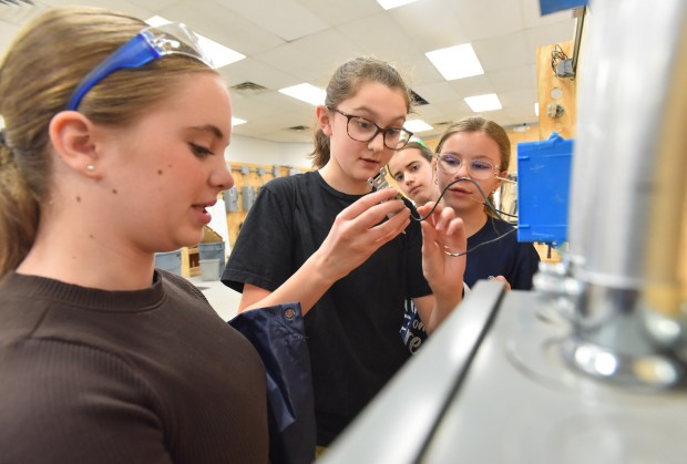 Susquehanna Community Elementary School sixth-grade students Harper Dubas, Fiona Carpenter, Aubrey Dran and Gabrielle Carpenter work on an electrical wiring project during the Girls on Fire STEM event at Johnson College in Scranton Wednesday, March 11, 2026. (SEAN MCKEAG / STAFF PHOTOGRAPHER)