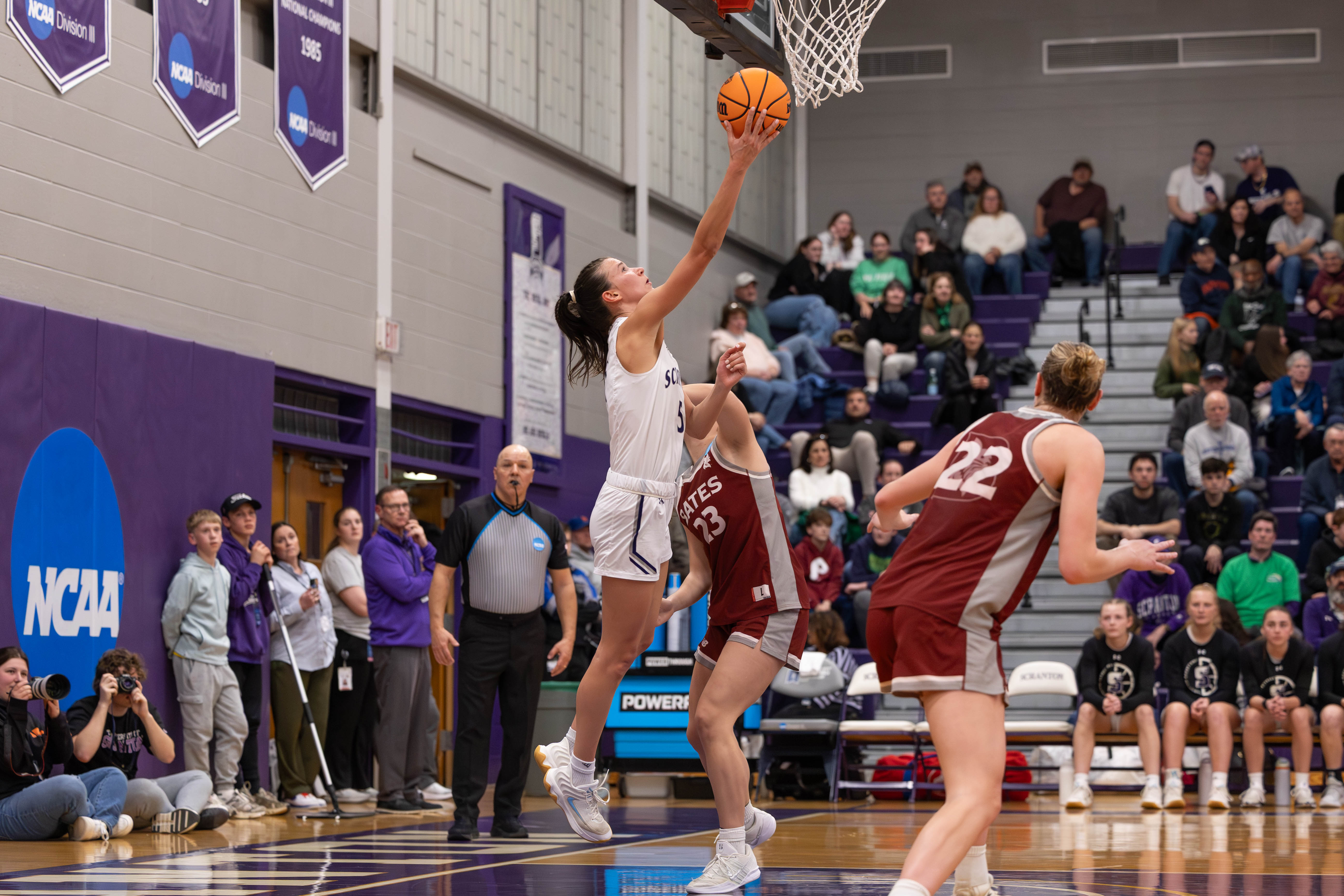 The University of Scranton’s Katie Gorski drives for a basket...