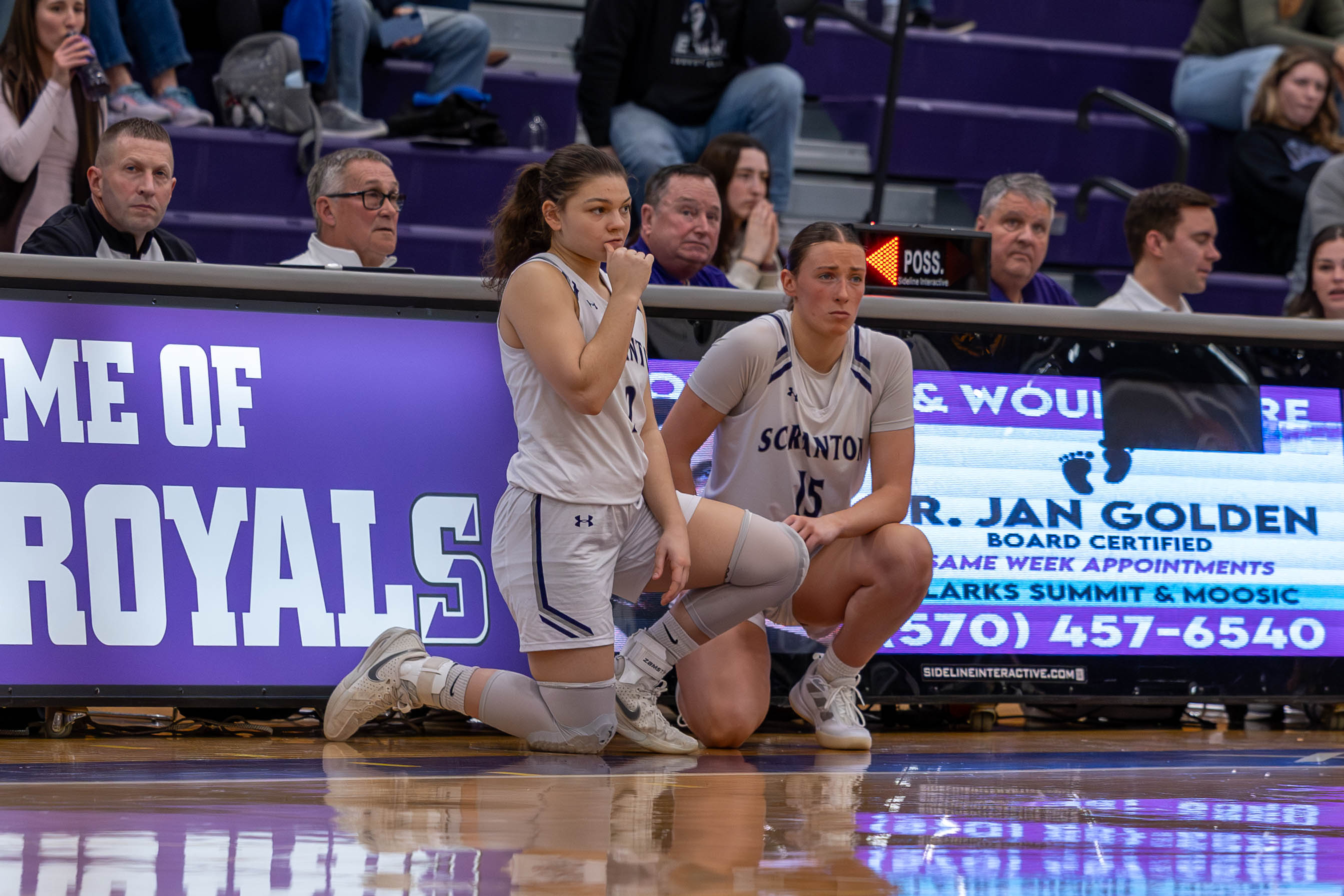 Junior Elizabeth Bennett, right, waiting to check into a game...