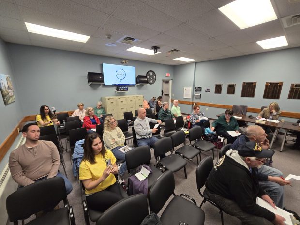 Residents listen to comments from representatives with PPL Electric Utilities, Pennsylvania American Water and the Lackawanna River Basin Sewer Authority during an Archbald Borough Council work session in the Borough Building on Wednesday, March 11, 2026. (FRANK WILKES LESNEFSKY / STAFF PHOTO)