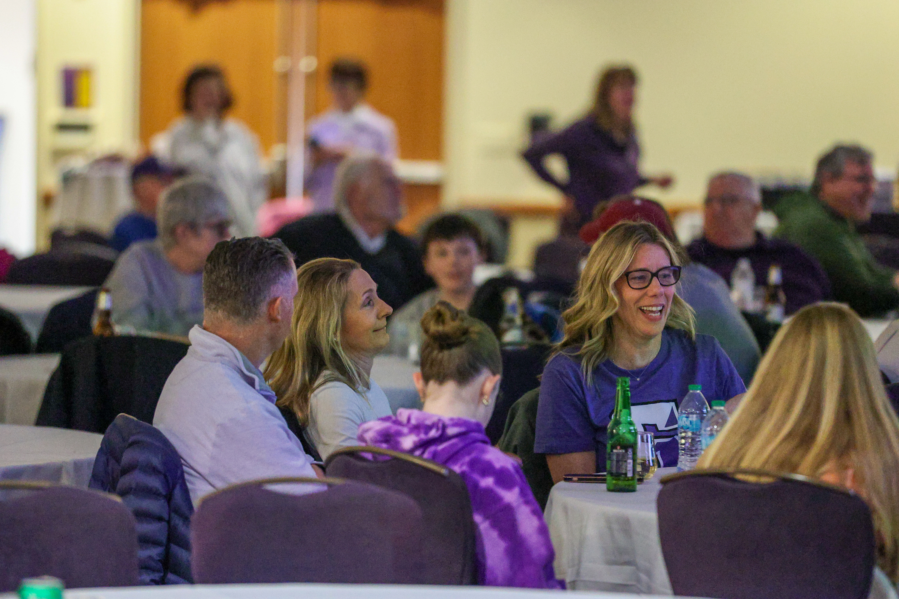 Attendees wait for the game to start during a watch...