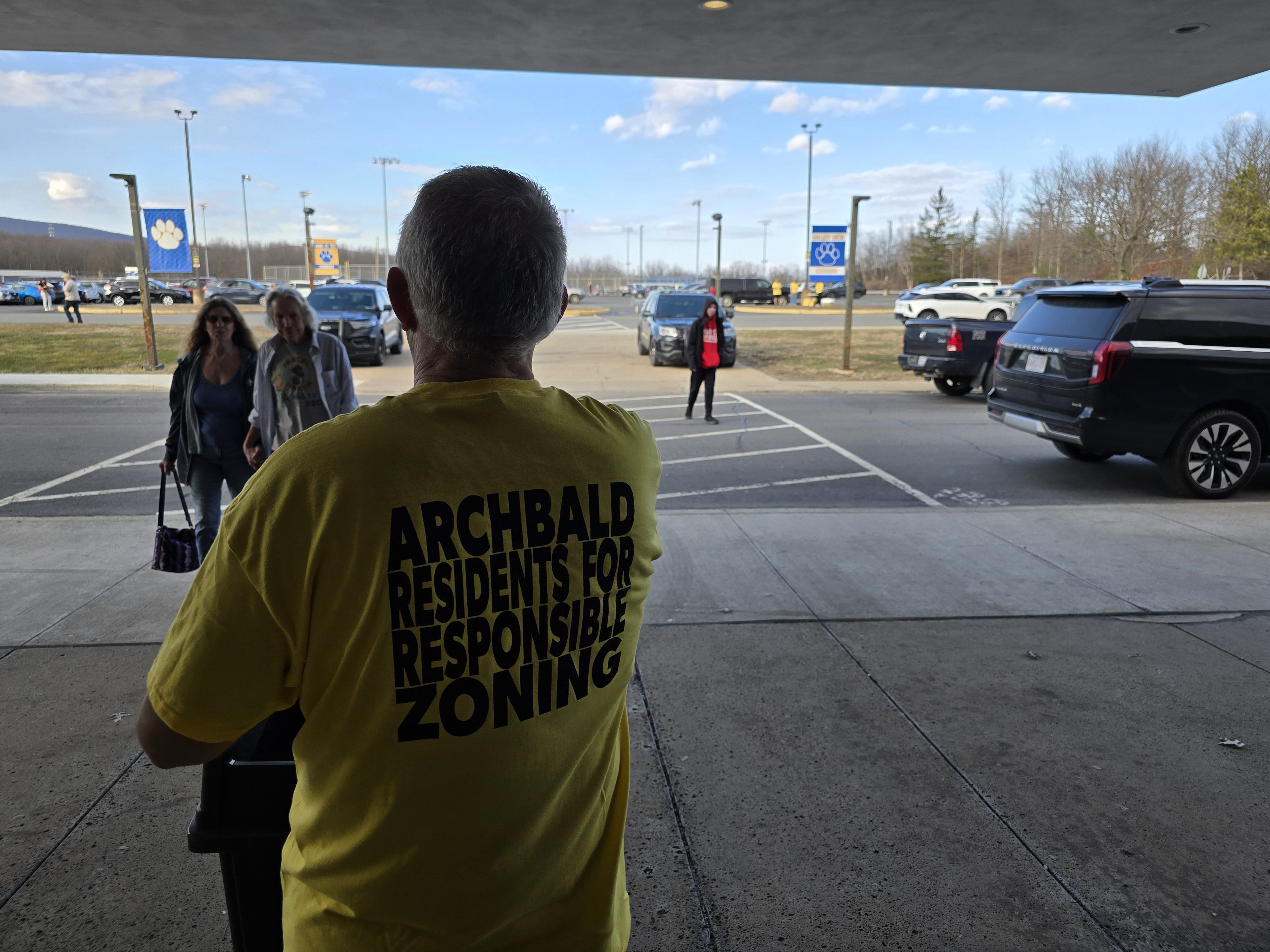 Archbald resident David Polansky hands out “NO DATA CENTER” signs...