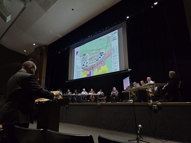 Attorney Justin Richards, who represents a group of borough residents opposing data centers, cross-examines witnesses from the Wildcat Ridge Data Center Campus during a public hearing at the Valley View High School in Archbald on Tuesday, March 10, 2026. (FRANK WILKES LESNEFSKY / STAFF PHOTO)