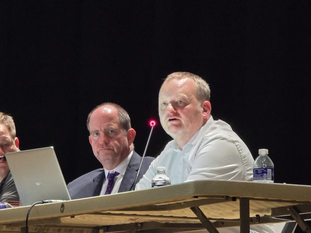 Cornell Realty Management Attorney Edmund J. Campbell Jr., left, looks on as data center consultant Ben Mitten speaks during a public hearing on the Wildcat Ridge Data Center Campus on Tuesday, March 10, 2026, at the Valley View High School in Archbald. (FRANK WILKES LESNEFSKY / STAFF PHOTO)