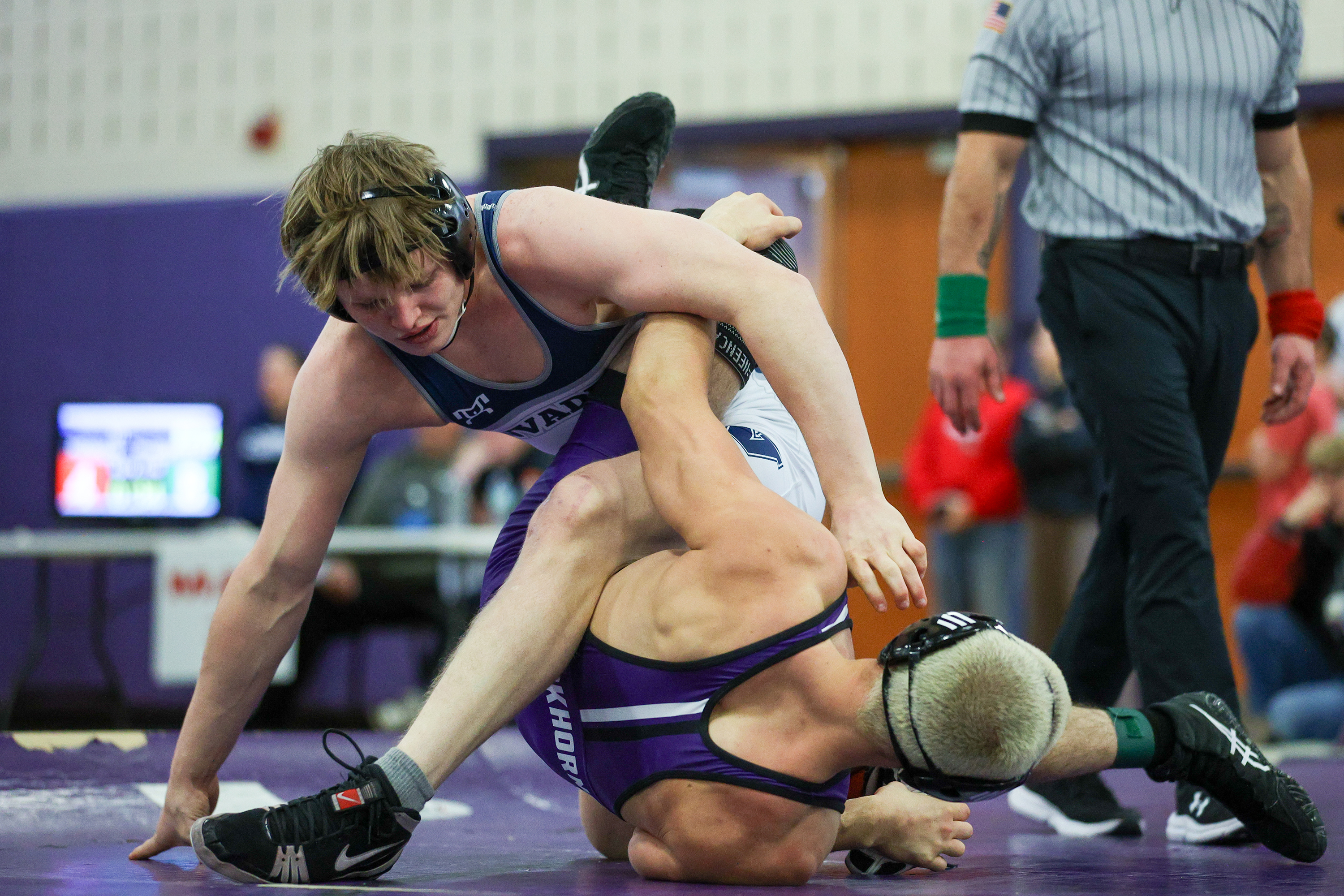 West Scranton’s Tommy Schechterly, top, wrestles Wallenpaupack’s Gabe Caufield during...
