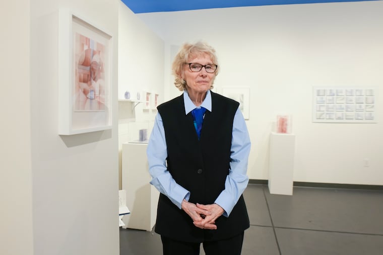 Diane Pepe, former University of the Arts professor, stands with her new work at Cerulean Arts Gallery. She had a show there for several weeks last month and in early March.