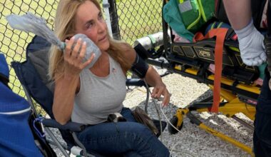 Stacy Durbin, of Clearwater Beach, Fla., holds ice to her eye after getting hit with a home run ball during the Phillies game on Thursday in Clearwater, Fla.