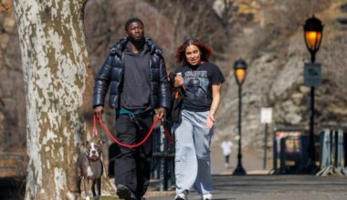 From left Milo (dog), Liam Kamara, and Jocilyn Koser walk along Kelly Drive in Philadelphia Friday afternoon.