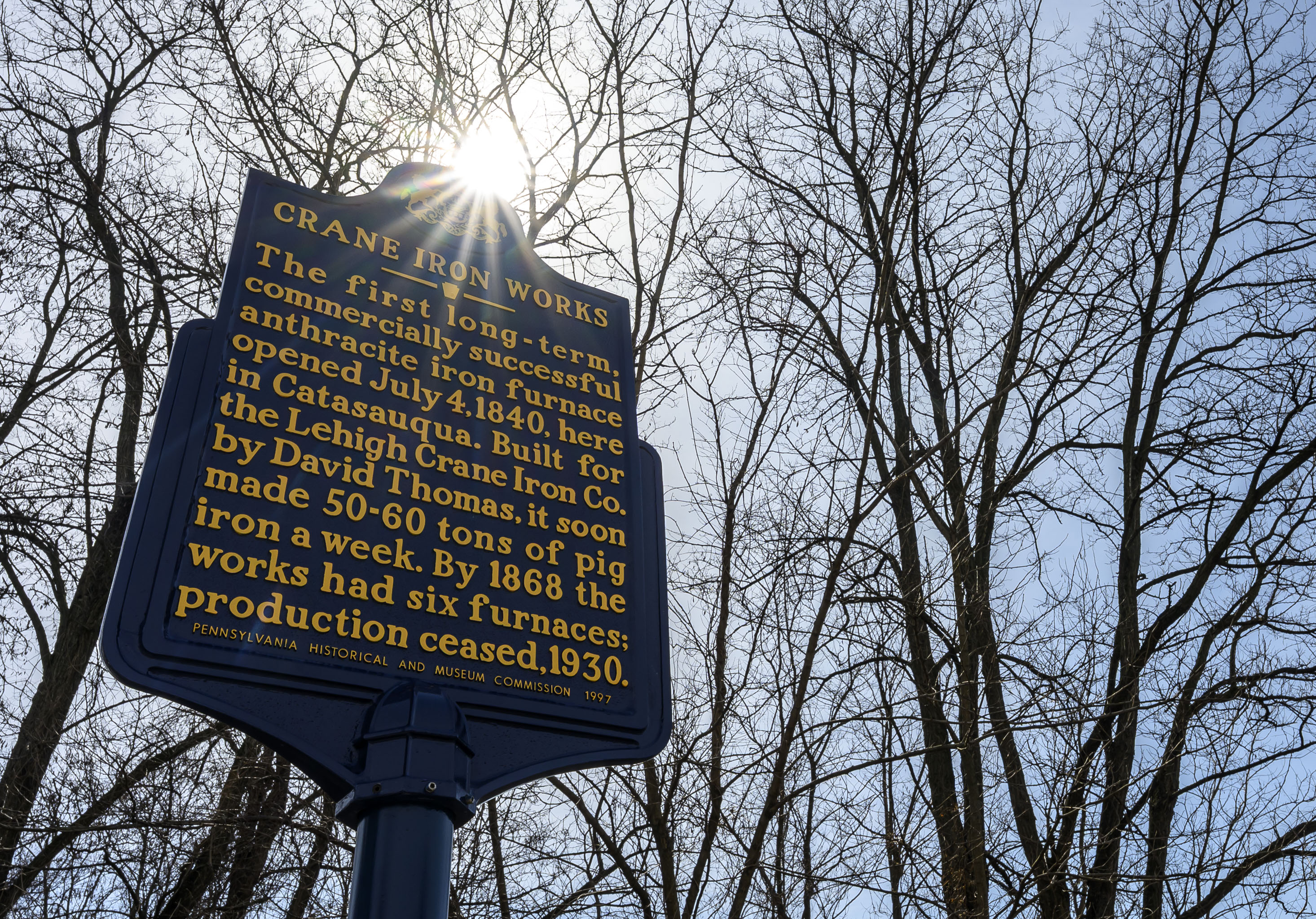 A historical marker shows the location of the former Crane...