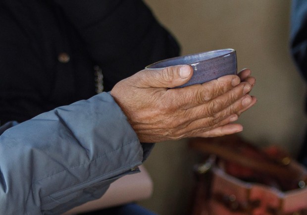 Michael Owen of Danielsville holds a cup of tea during the Bethlehem-Tondabayashi Sister City Commission's annual Cherry Blossom Festival on Saturday, March 28, 2026, at the Garden of Serenity in Bethlehem. The festival featured Japanese music, food, origami and tea ceremonies. (Jane Therese/Special to The Morning Call)