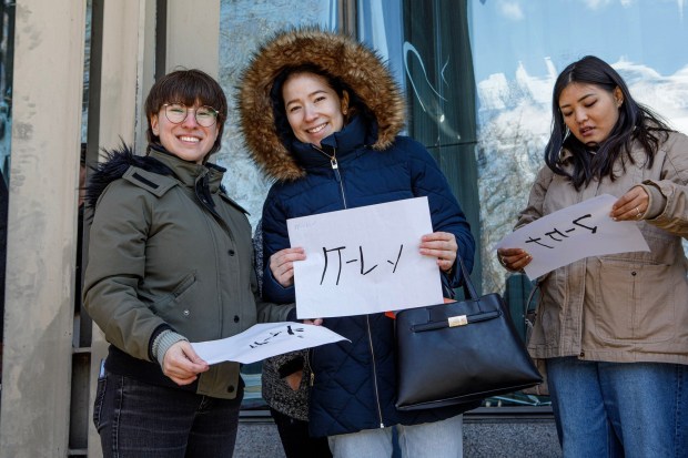 Zeke Fuica, his sister Karen Fuica both of Northampton and Mckenna Lee of Emmaus pose with their calligraphy artwork during the Bethlehem-Tondabayashi Sister City Commission's annual Cherry Blossom Festival on Saturday, March 28, 2026, at the Garden of Serenity in Bethlehem. The festival featured Japanese music, food, origami and tea ceremonies. (Jane Therese/Special to The Morning Call)