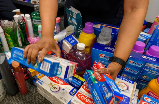 Transportation Security Administration agents sort through donated items during a Fill the Bus donation drive Thursday, March 19, 2026, at Lehigh Valley International Airport. More than 20 carts were filled with donated paper products; toiletries, diapers and other baby products; gift cards; and nonperishable foods and beverages for TSA and Federal Aviation Administration workers at the airport who aren't being paid during the partial federal government shutdown. (April Gamiz/The Morning Call)