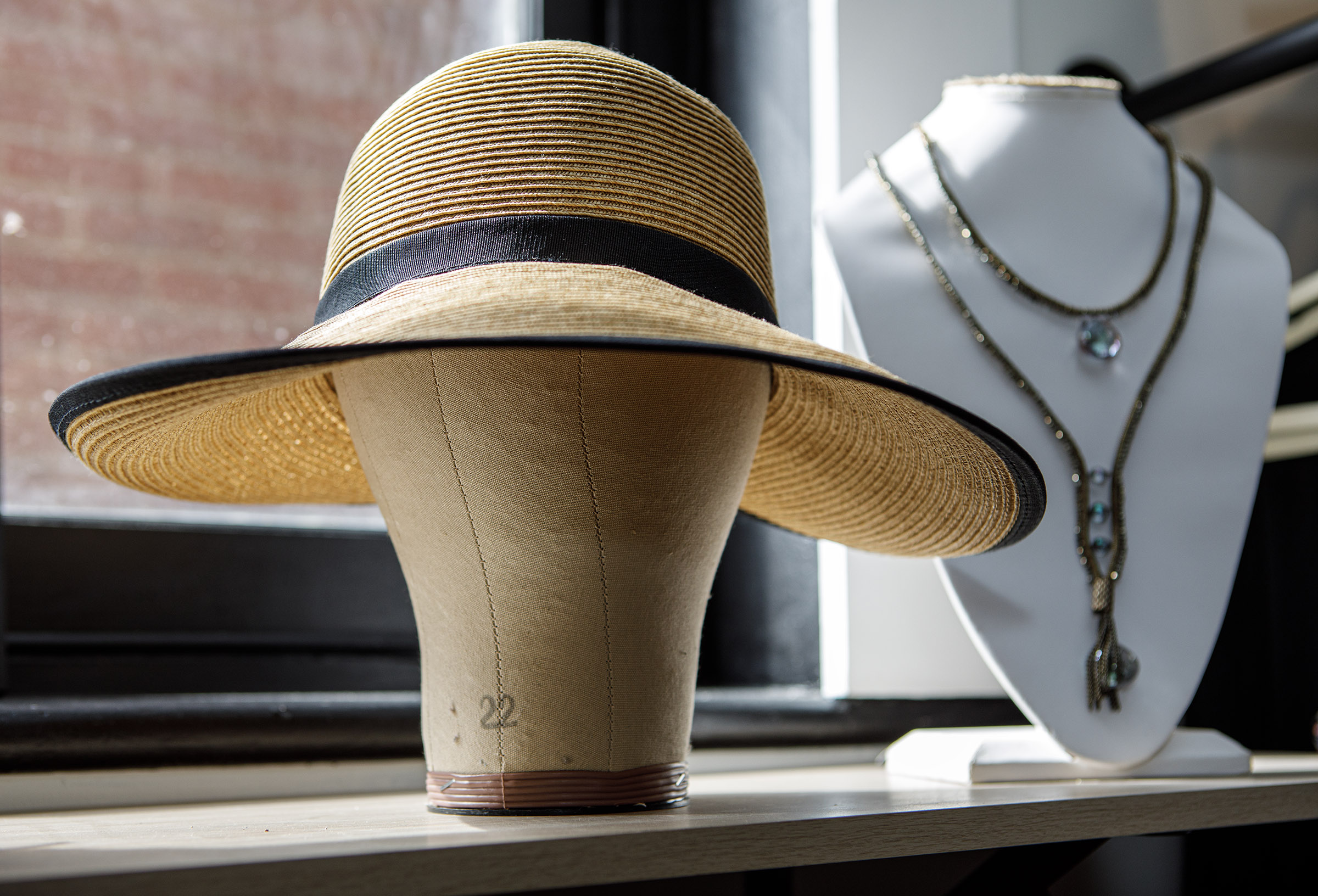 A display inside Indulge Designer Resale Boutique poses inside her...