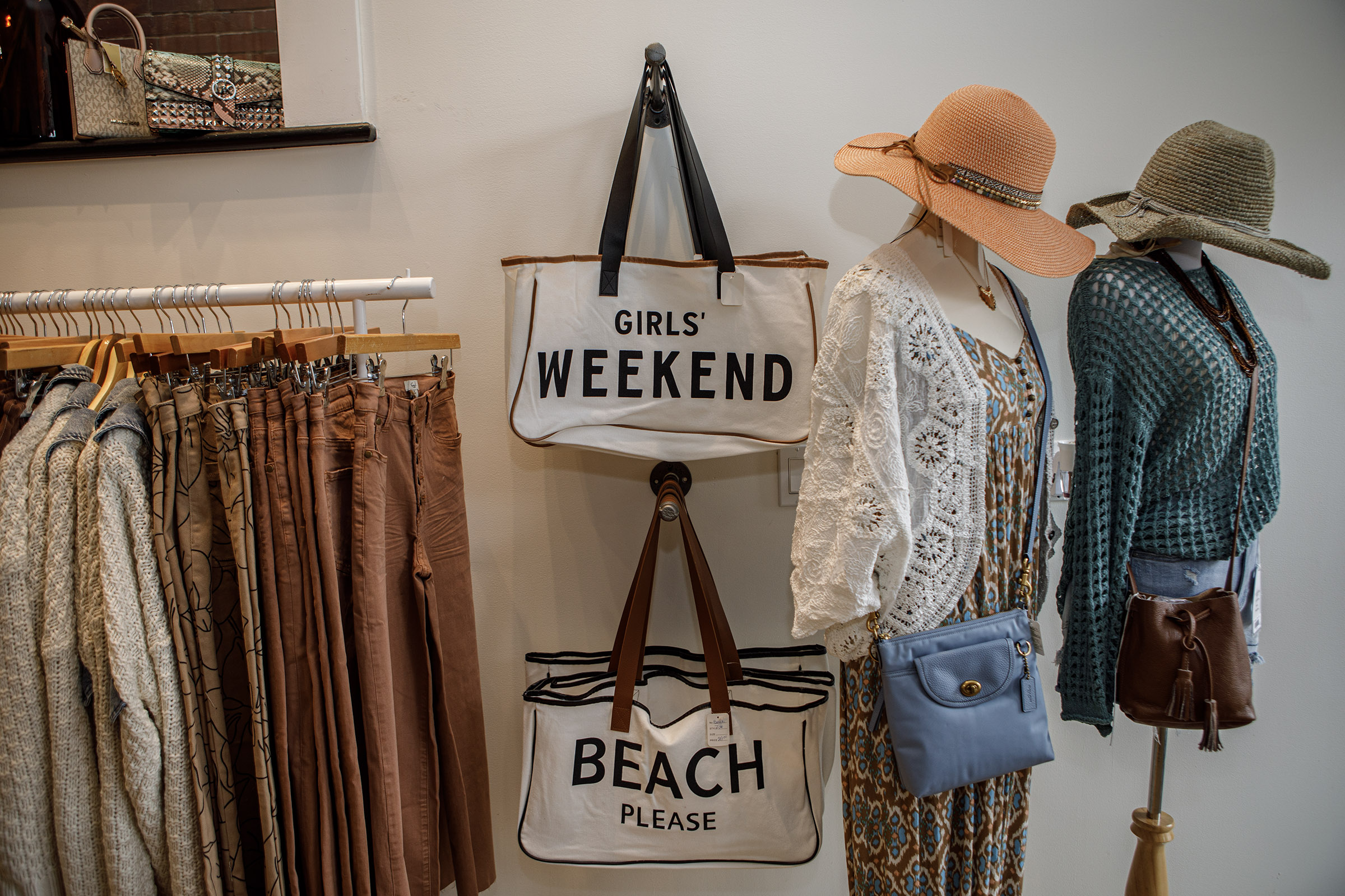 A display inside Indulge Designer Resale Boutique poses inside her...