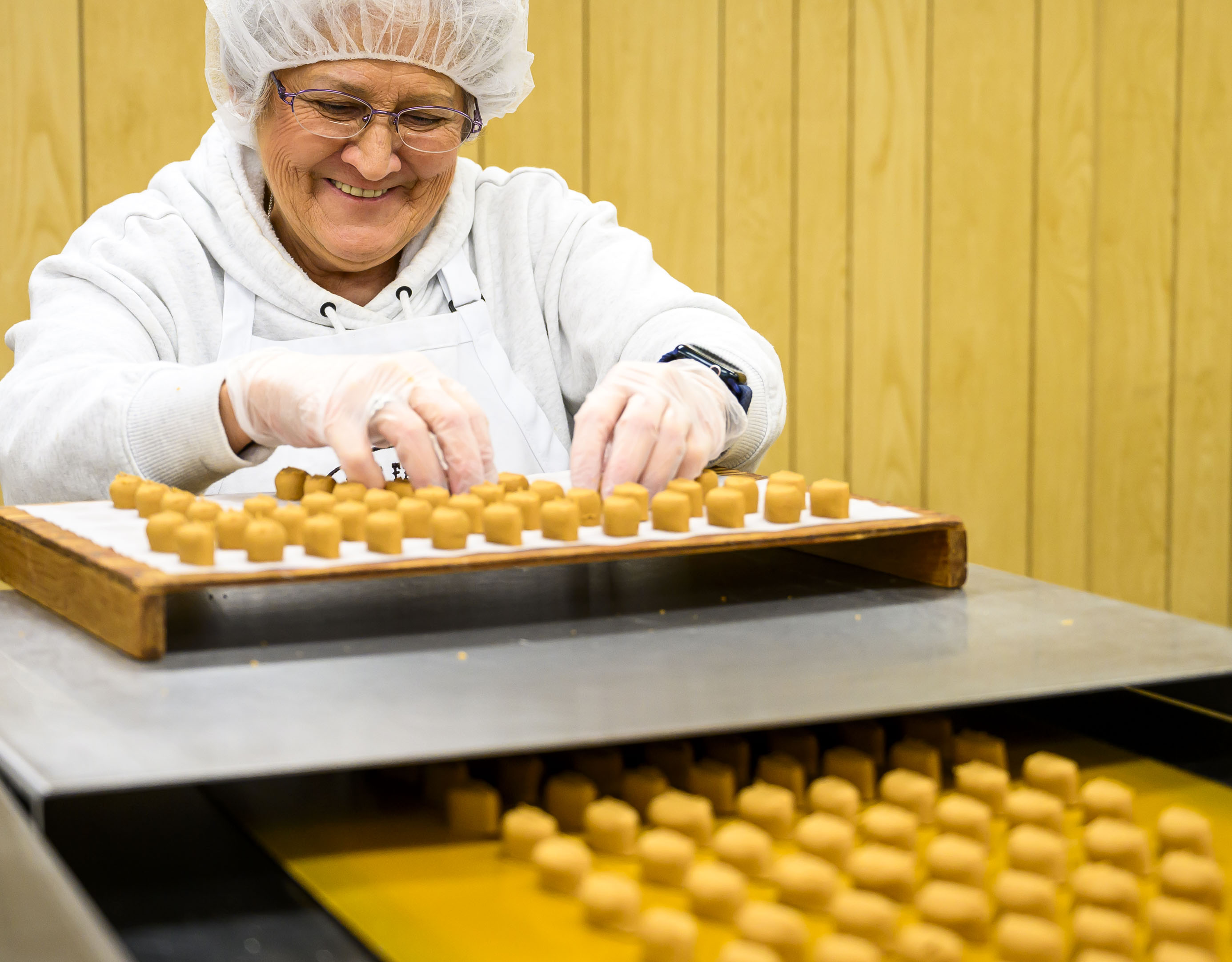 Georgia Keim works on the production line making peanut butter...