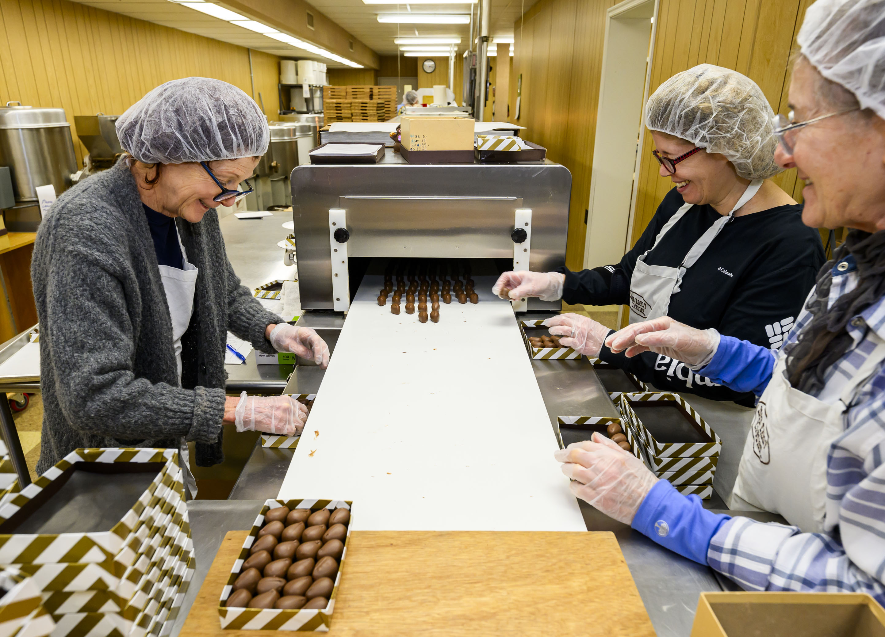 Beth Smith, Monca Donati and Victoria Helvig work together on...