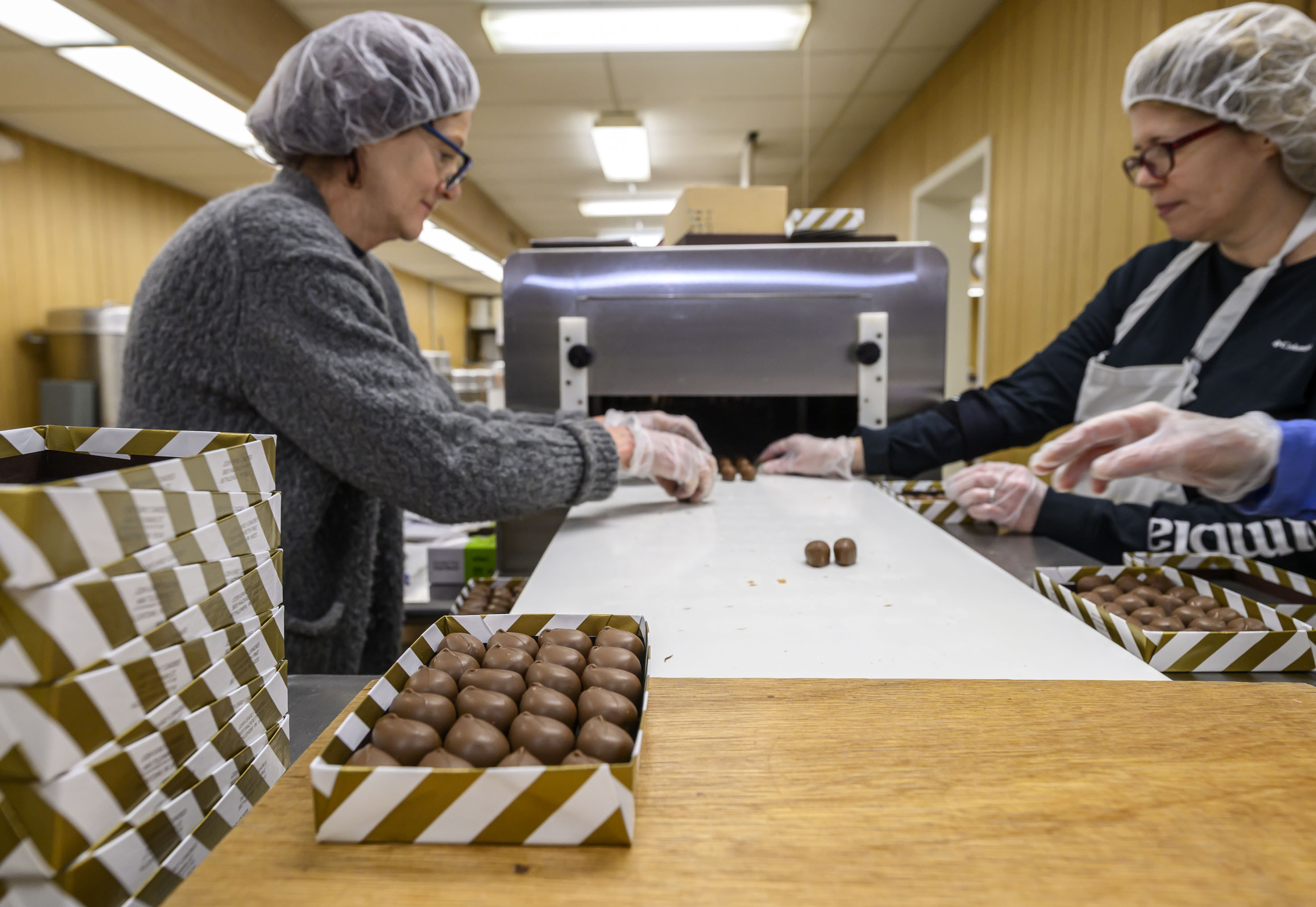 Beth Smith, Monca Donati and Victoria Helvig work together on...