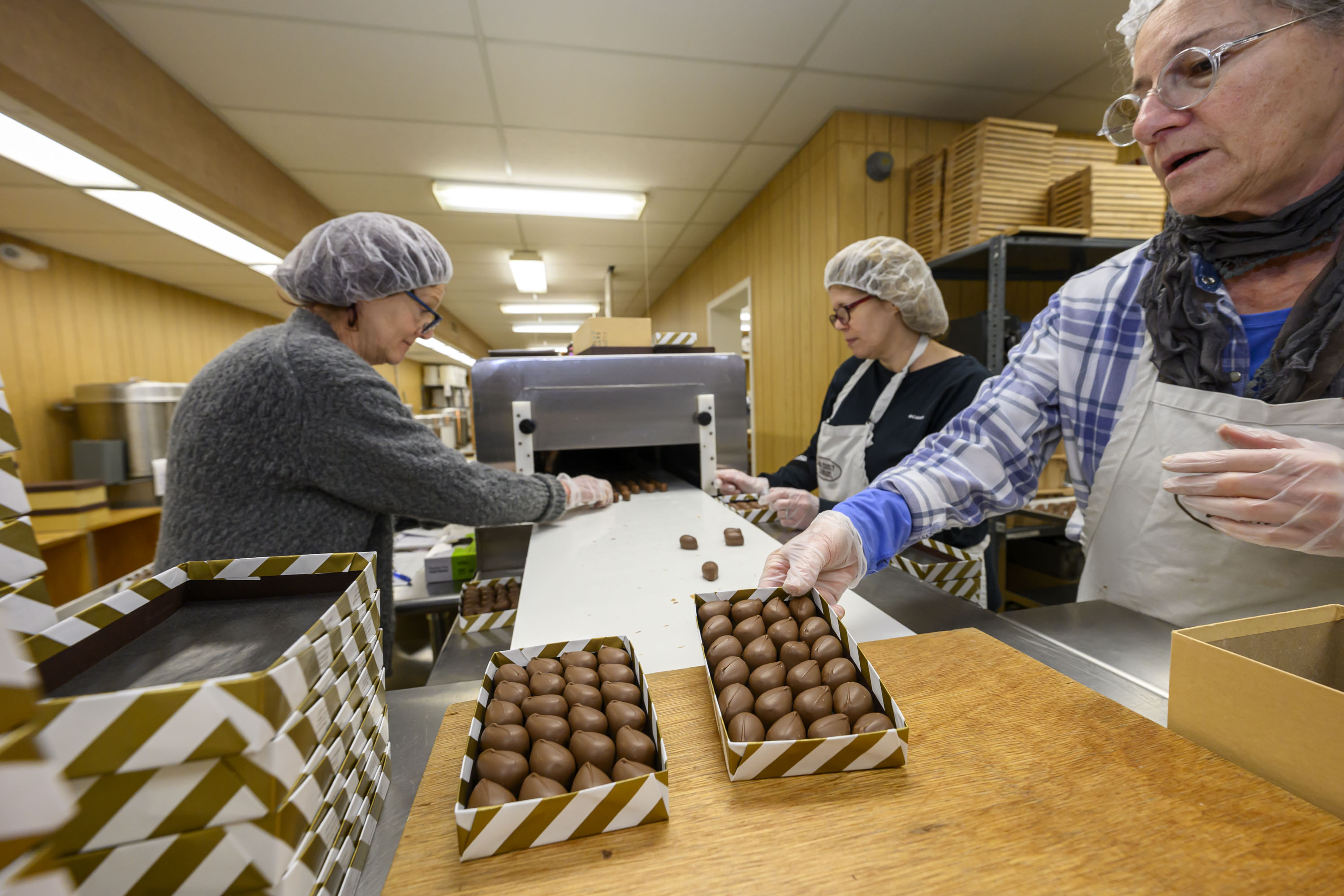 Beth Smith, Monca Donati and Victoria Helvig work together on...