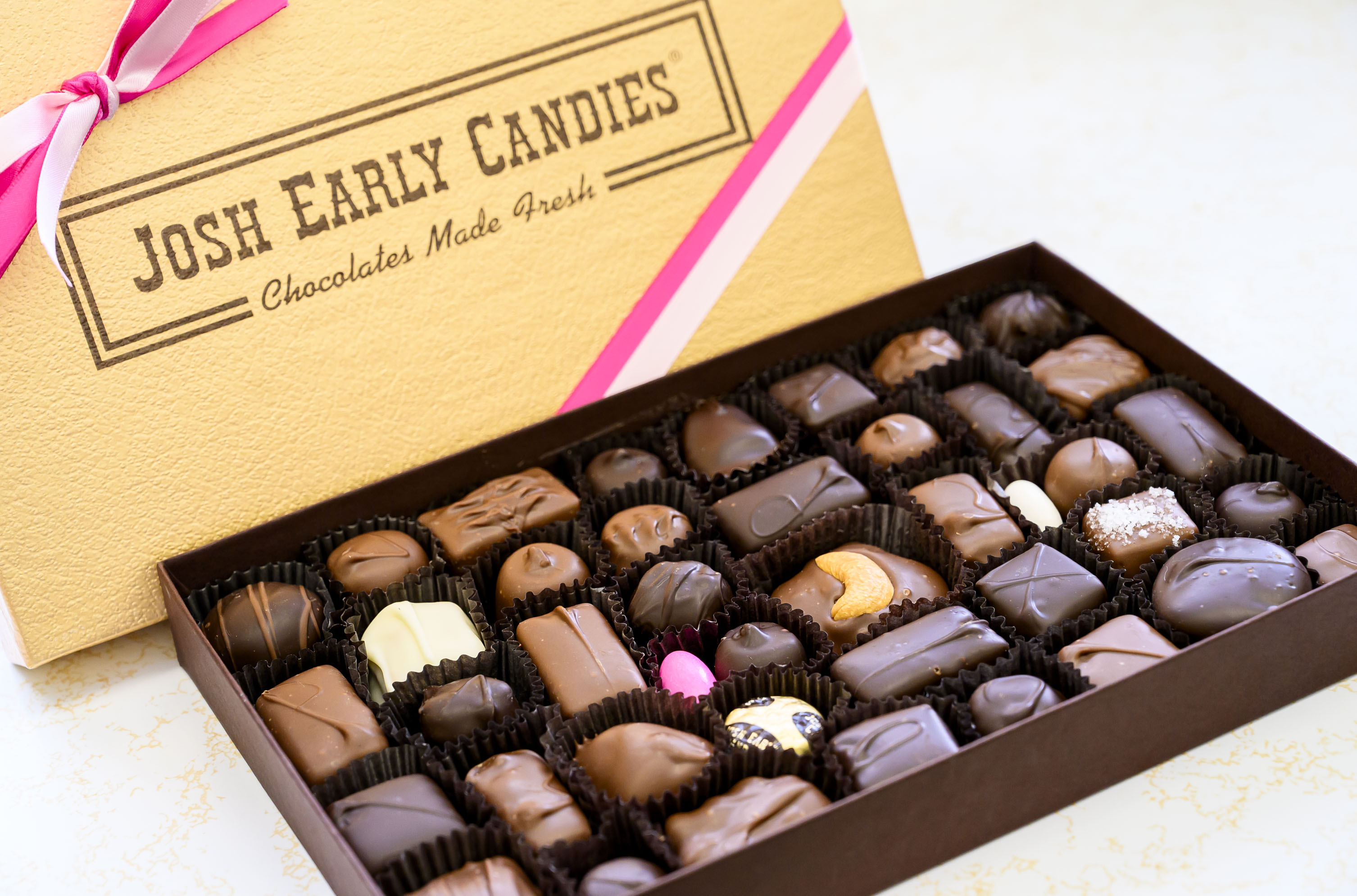 Josh Early Candies’ 17-ounce gold gift box of assorted chocolates...