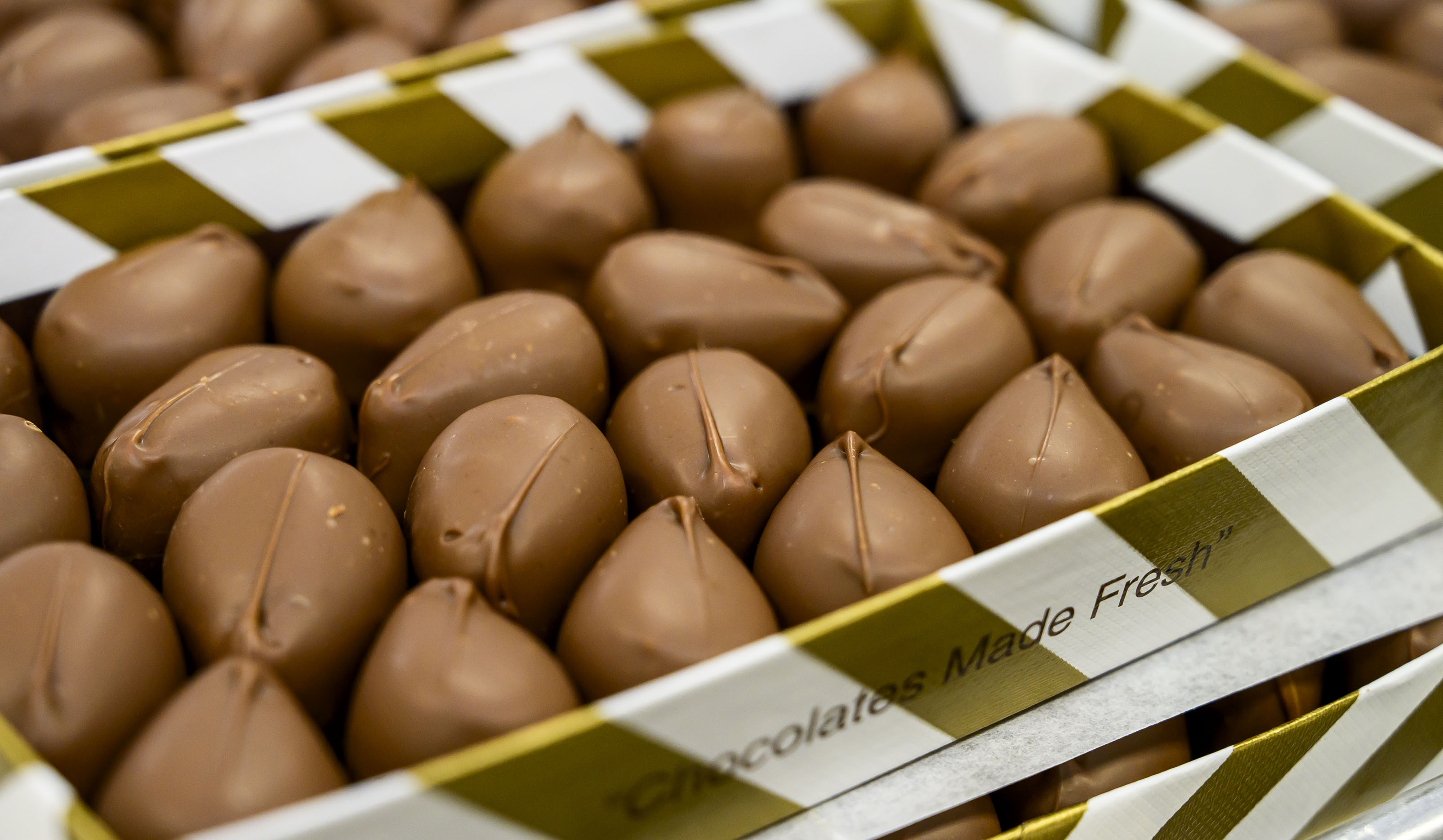 Hand-crafted peanut butter cream eggs are ready to be boxed...