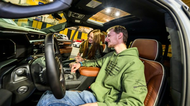 Damian Heinz of Allentown and Jocelynn Krasley of Emmaus check out a GMC Sierra 1500 on Wednesday, March 18, 2026, during Lehigh Valley Auto Show 2026 at Lehigh University's Goodman Campus in Bethlehem. The show features more than 400 vehicles from 66 different brands and runs Thursday-Saturday: 10 a.m.- 8 p.m.; Sunday: 10 a.m.-5 p.m. (April Gamiz/The Morning Call)