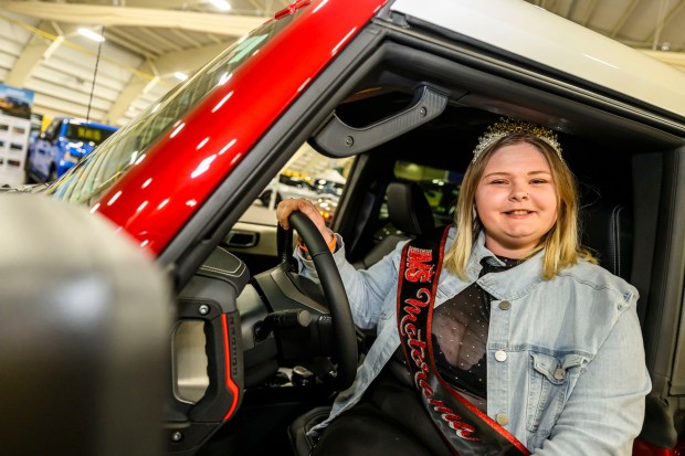 Ms. Motorama 2026 Madison Deal of Hummelstown checks out a Ford Bronco Wednesday, March 18, 2026, during Lehigh Valley Auto Show 2026 at Lehigh University's Goodman Campus in Bethlehem. The show features more than 400 vehicles from 66 different brands and runs Thursday-Saturday: 10 a.m.- 8 p.m.; Sunday: 10 a.m.-5 p.m. (April Gamiz/The Morning Call)
