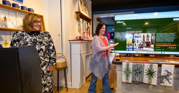 Brianna Lasko of Lovely by Brianna casts the first vote as Kelly Ronalds, general manager of Historic Hotel Bethlehem, watches Monday, March 9, 2026, during a news conference at Schropp Dry Goods Shoppe in Bethlehem unveiling that Main Street in Bethlehem was nominated in USA Today's 10Best Main Street competition for 2026. It won in 2025 in an effort led by the hotel's marketing team. The news conference also introduced the Our Star Shines All Year Round marketing campaign to encourage travelers to visit the city. (April Gamiz/The Morning Call)