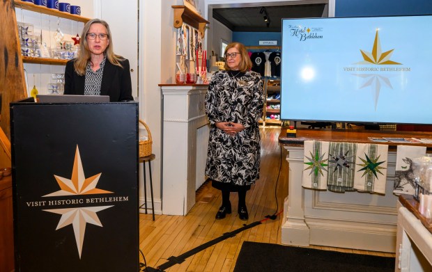 Kimberly O'Neill, the owner of Knobs and Knockers, speaks as Kelly Ronalds, general manager of Historic Hotel Bethlehem, watches Monday, March 9, 2026, during a news conference at Schropp Dry Goods Shoppe in Bethlehem unveiling that Main Street in Bethlehem was nominated in USA Today's 10Best Main Street competition for 2026. It won in 2025. The news conference also introduced the Our Star Shines All Year Round marketing campaign to encourage travelers to visit the city. (April Gamiz/The Morning Call)