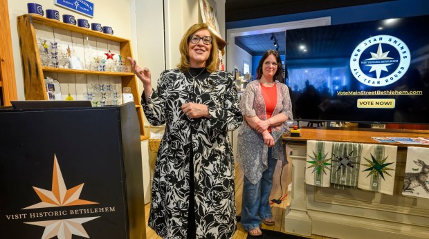 Kelly Ronalds, general manager of the Historic Hotel Bethlehem, speaks as Brianna Lasko of Lovely by Brianna, watches Monday, March 9, 2026, during a news conference at Schropp Dry Goods Shoppe in Bethlehem unveiling that Main Street in Bethlehem was nominated in USA Today's 10Best Main Street competition for 2026. It won in 2025 in an effort led by the hotel's marketing team. The news conference also introduced the Our Star Shines All Year Round marketing campaign to encourage travelers to visit the city. (April Gamiz/The Morning Call)