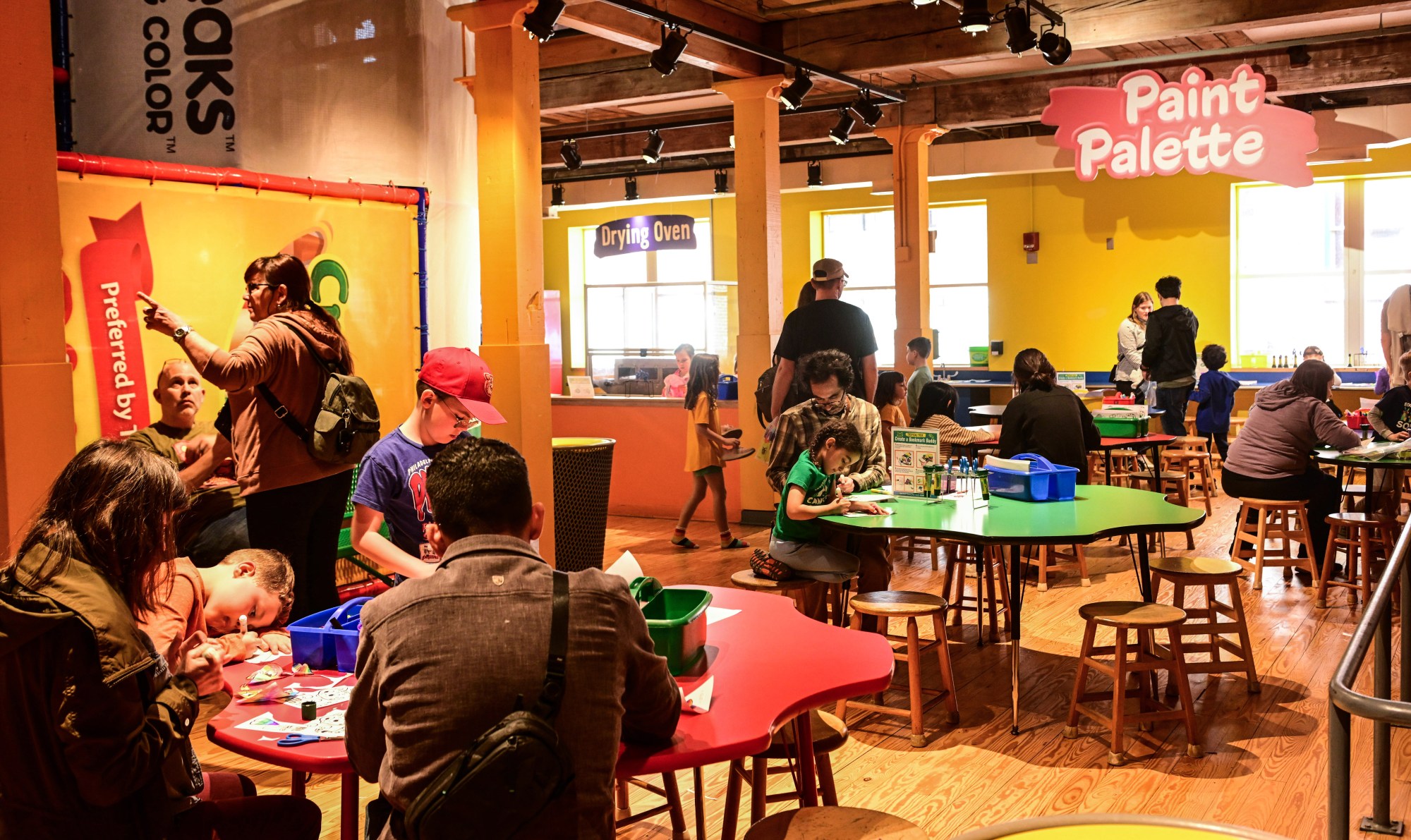 People visit the Crayola Experience on Monday, March 30, 2026, in Easton, to enjoy a scavenger hunt and other activities ahead of National Crayon Day on Tuesday. Hundreds of crayon lovers will be celebrating with Crayola Experience, kicking off the brand's Million Crayon Giveaway by creating their free, one-of-a-kind crayon box. Families registered for the giveaway will have the colorful experience of customizing a 32-count crayon box with any color assortment of their favorite Crayola crayons from a 40-foot-long Pick Your Pack wall holding nearly half a million crayonsincluding the official return of the beloved Crayola color Dandelionfor good. (Monica Cabrera/The Morning Call)