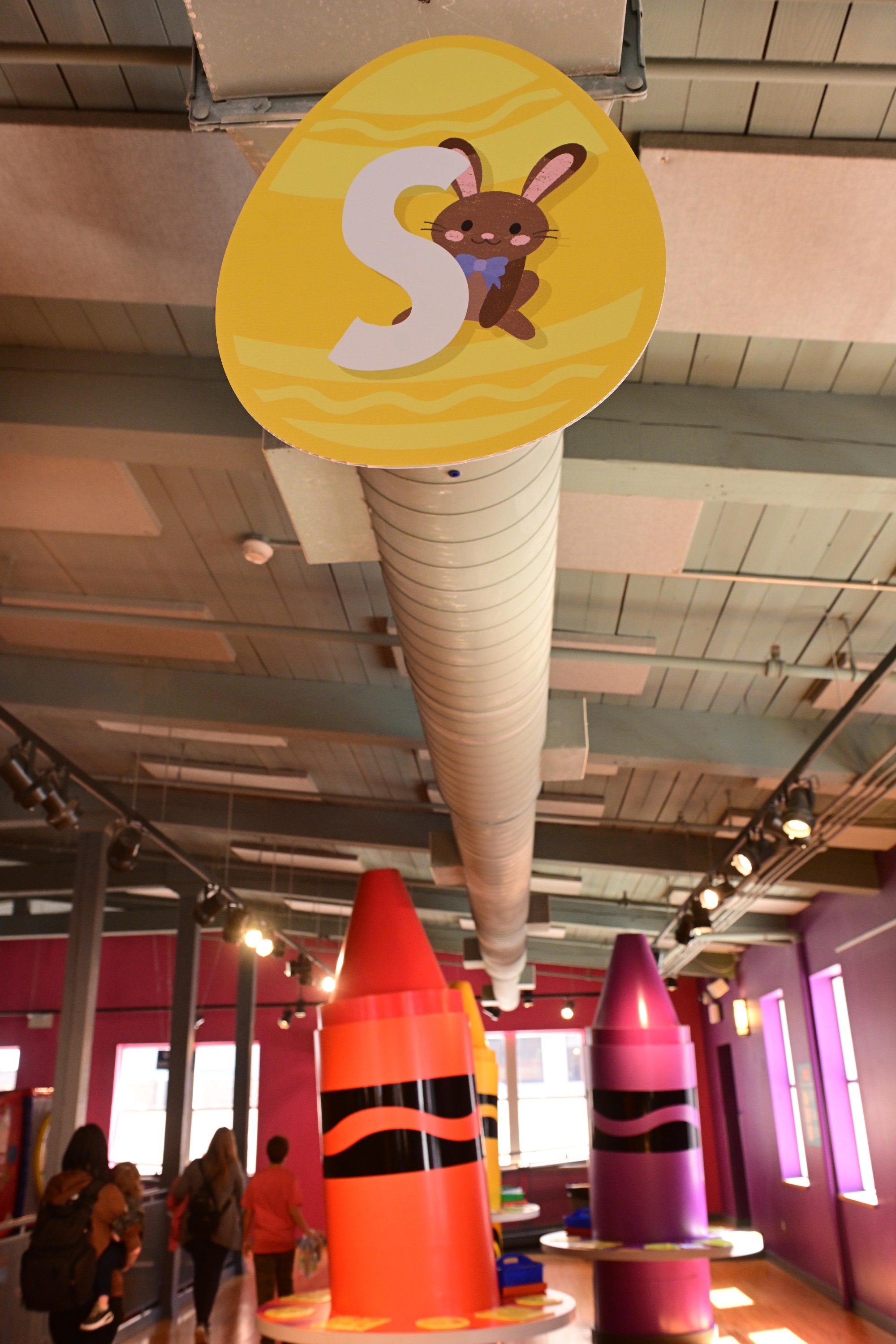 The letter "S" hangs from the ceiling Monday, March 30, 2026, at the Crayola Experience in Easton, as part of a scavenger hunt activity leading up to National Crayon Day on Tuesday. Hundreds of crayon lovers will be celebrating with Crayola Experience, kicking off the brand's Million Crayon Giveaway by creating their free, one-of-a-kind crayon box. Families registered for the giveaway will have the colorful experience of customizing a 32-count crayon box with any color assortment of their favorite Crayola crayons from a 40-foot-long Pick Your Pack wall holding nearly half a million crayonsincluding the official return of the beloved Crayola color Dandelionfor good. (Monica Cabrera/The Morning Call)