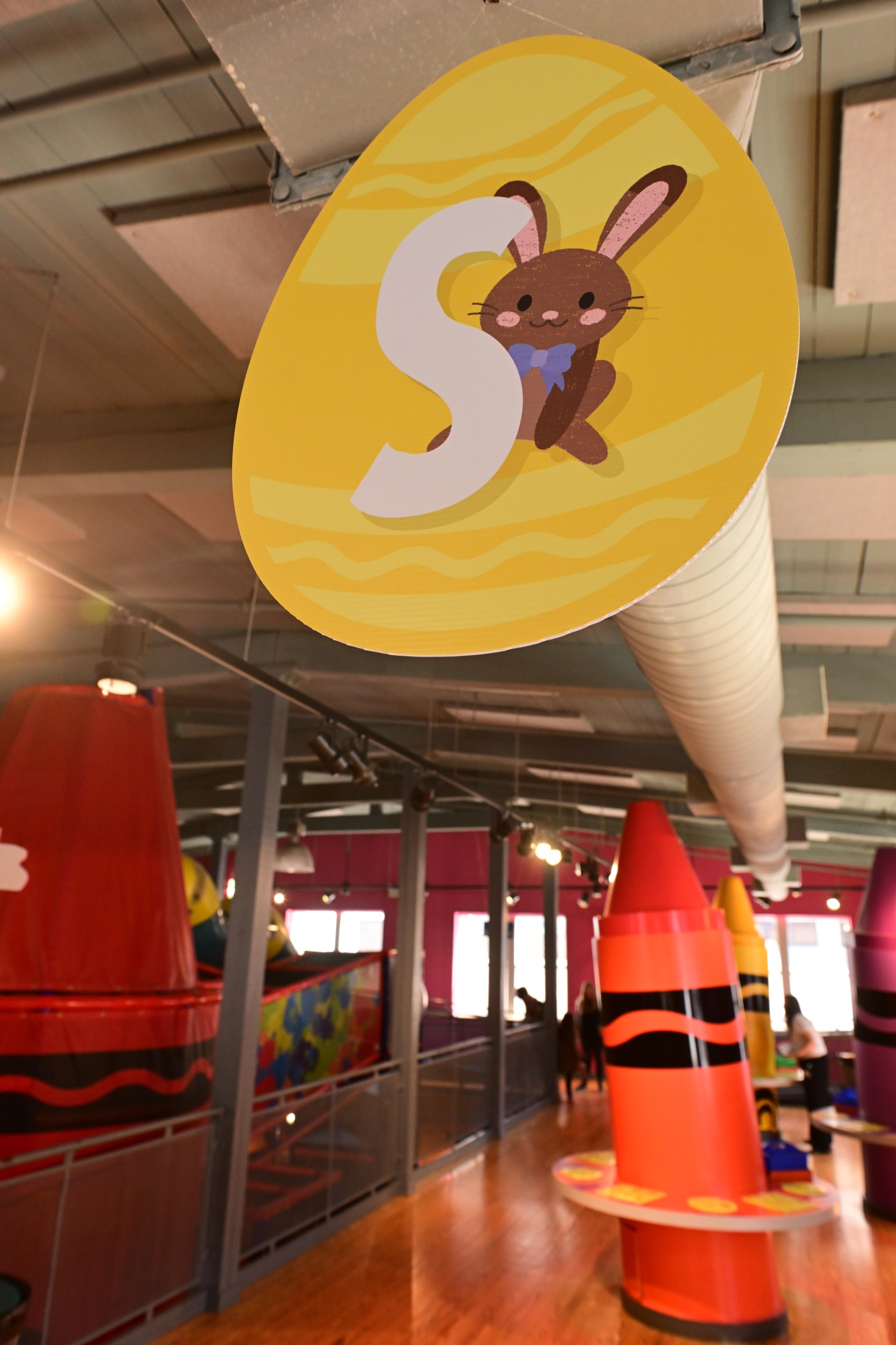 The letter "S" hangs from the ceiling Monday, March 30, 2026, at the Crayola Experience in Easton, as part of a scavenger hunt activity leading up to National Crayon Day on Tuesday. Hundreds of crayon lovers will be celebrating with Crayola Experience, kicking off the brand's Million Crayon Giveaway by creating their free, one-of-a-kind crayon box. Families registered for the giveaway will have the colorful experience of customizing a 32-count crayon box with any color assortment of their favorite Crayola crayons from a 40-foot-long Pick Your Pack wall holding nearly half a million crayonsincluding the official return of the beloved Crayola color Dandelionfor good. (Monica Cabrera/The Morning Call)