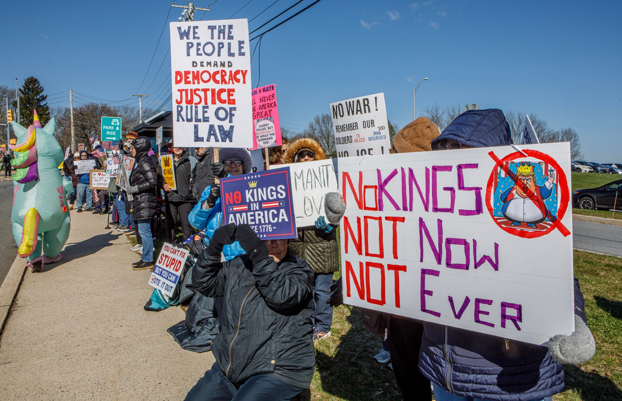 People protest as part of the No Kings protest at Emrick Boulevard and William Penn Highway on Saturday, March 28, 2026, in Bethlehem Township. Lehigh Valley activists said they hoped Saturday's protests would become a tipping point in the anti-Trump movement, with thousands expected to participate in events locally and millions nationwide. (Jane Therese/Special to The Morning Call)