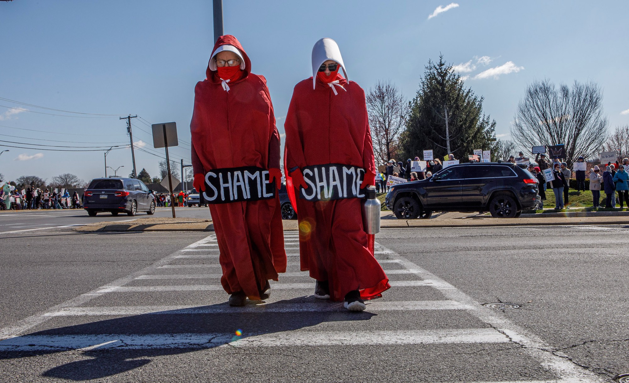 Lydia Golas and Jennifer LaTorre both of Nazareth protest as Handmaids during the No Kings protest at Emrick Boulevard and William Penn Highway on Saturday, March 28, 2026, in Bethlehem Township. Lehigh Valley activists said they hoped Saturday's protests would become a tipping point in the anti-Trump movement, with thousands expected to participate in events locally and millions nationwide. (Jane Therese/Special to The Morning Call)