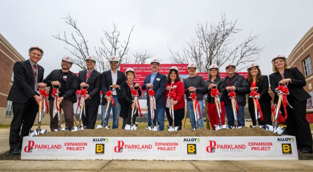 Parkland Area School district educators and others throw dirt with shovels Friday, March 6, 2026, during the groundbreaking for an 84,914-square-foot addition at Parkland High School in South Whitehall Township. That construction, plus renovations, is expected to be done by December 2027. The expansion and renovation will include: 30 new classrooms, 16 new labs, two enclosed, outdoor courtyards, a renovated media center and cafeteria and a new athletics entrance and lobby. (April Gamiz/The Morning Call)