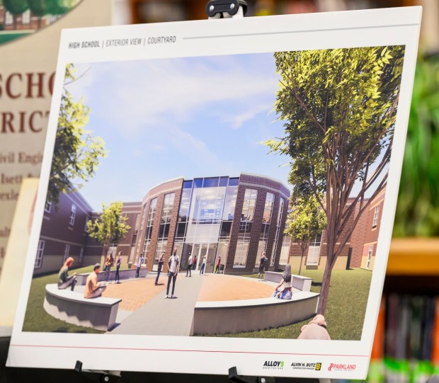 A rendering is on display of an exterior courtyard Friday, March 6, 2026, during the groundbreaking for an 84,914-square-foot addition at Parkland High School in South Whitehall Township. That construction, plus renovations, is expected to be done by December 2027. The expansion and renovation will include: 30 new classrooms, 16 new labs, two enclosed, outdoor courtyards, a renovated media center and cafeteria and a new athletics entrance and lobby. (April Gamiz/The Morning Call)
