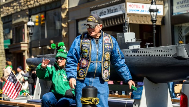 Bob Obrecht smiles at the crowd as he rides on the U.S. submarine veterans float Saturday, March 14, 2026, during the 16th annual Parade of Shamrocks in downtown Bethlehem. The parade was presented by the Celtic Cultural Alliance and Historic Hotel Bethlehem. The St. Patrick's Day celebration featured pipe bands, school marching bands and community groups, starting on Broad Street and ending under the Hill-To-Hill Bridge. (April Gamiz/The Morning Call)