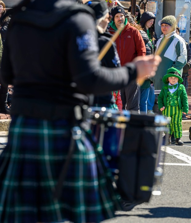 Samantha Harrison and son Bodey Price, 3, both of Bethlehem enjoy the festivities Saturday, March 14, 2026, during the 16th annual Parade of Shamrocks in downtown Bethlehem. The parade was presented by the Celtic Cultural Alliance and Historic Hotel Bethlehem. The St. Patrick's Day celebration featured pipe bands, school marching bands and community groups, starting on Broad Street and ending under the Hill-To-Hill Bridge. (April Gamiz/The Morning Call)