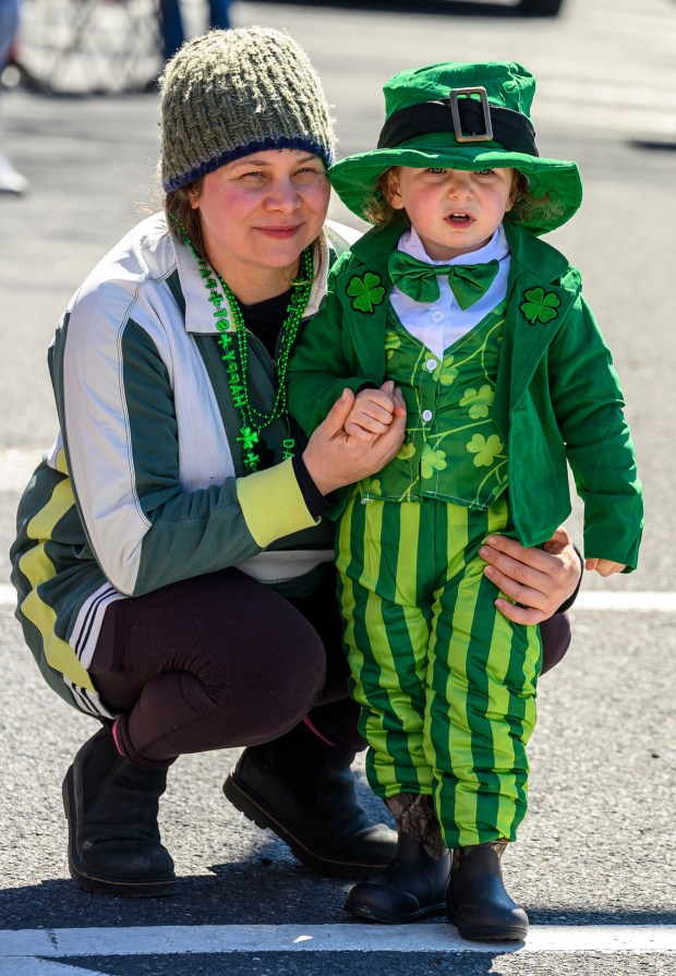 Samantha Harrison and son Bodey Price, 3, both of Bethlehem enjoy the festivities Saturday, March 14, 2026, during the 16th annual Parade of Shamrocks in downtown Bethlehem. The parade was presented by the Celtic Cultural Alliance and Historic Hotel Bethlehem. The St. Patrick's Day celebration featured pipe bands, school marching bands and community groups, starting on Broad Street and ending under the Hill-To-Hill Bridge. (April Gamiz/The Morning Call)